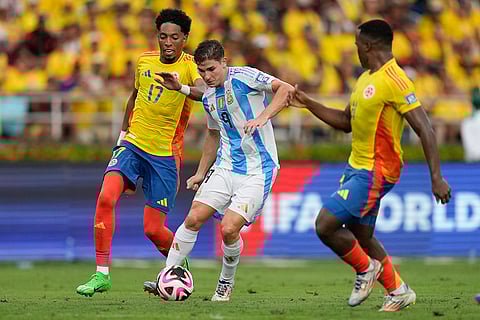 2026 FIFA World Cup Qualifying, Colombia vs Argentina: Colombia's Johan Mojica, left, and Argentina's Julian Alvarez battle for the ball